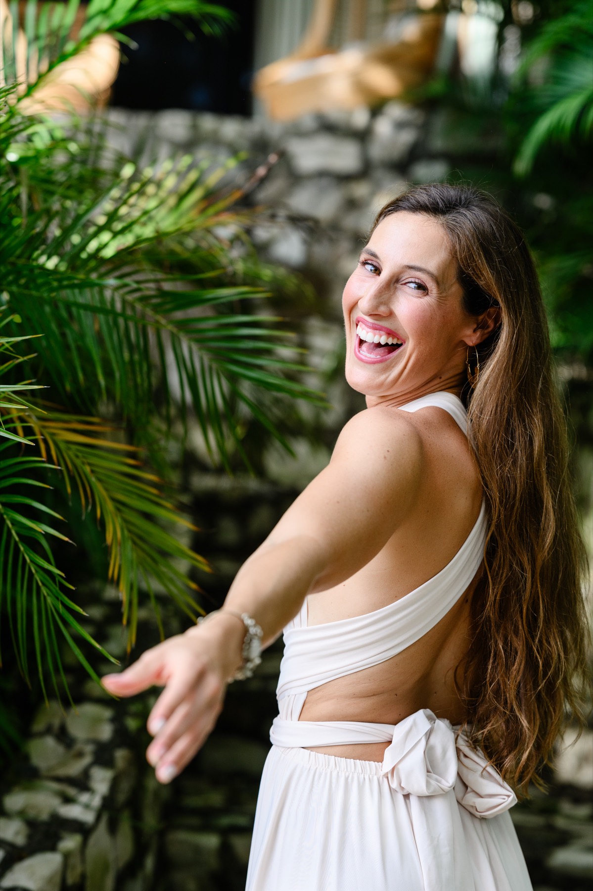 Hannah Maher, laughing among the palms